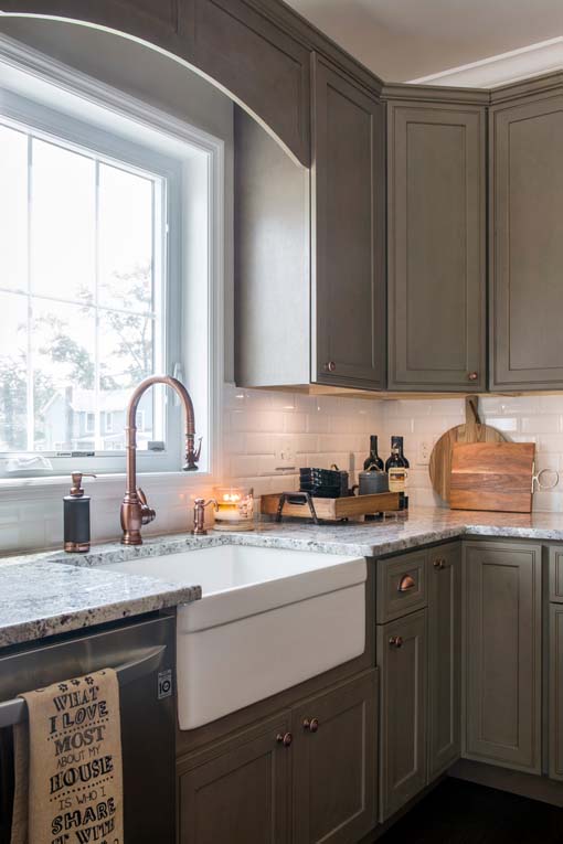 Kitchen cabinets in medium dark green color